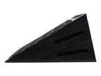 A set of black rubber vehicle ramp blocks stacked diagonally on a plain white background.