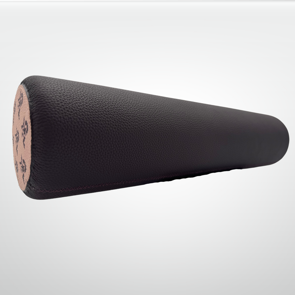 Black foam roller on a light gray background
