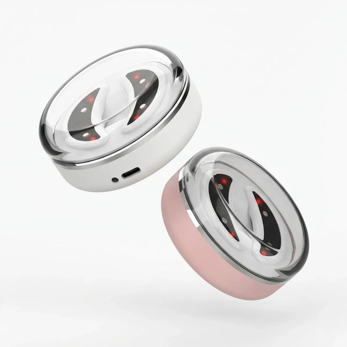 Two metallic containers, one silver and one pink, on a white background