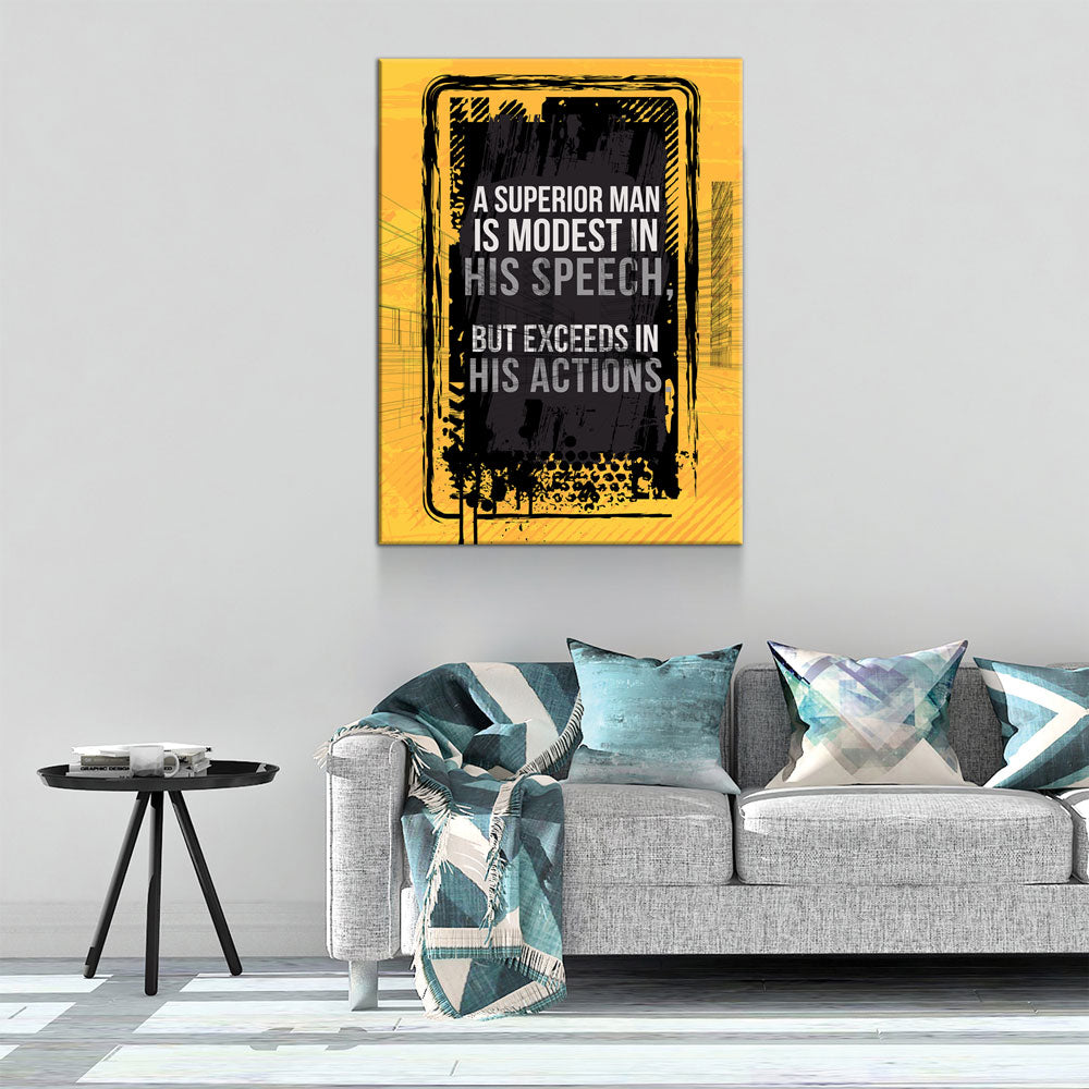 Living room with a gray sofa, decorative pillows, and a motivational quote poster on the wall.