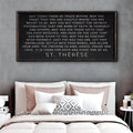 Framed quote by St. Therese above a bed with pillows and bedding.