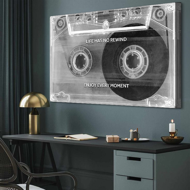 Cassette tape wall art with motivational quote in a modern office setting