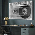 Cassette tape wall art with motivational quote in a modern office setting