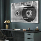 Cassette tape wall art with motivational quote in a modern office setting