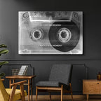 Cassette tape design wall art with motivational quote in a modern living room.