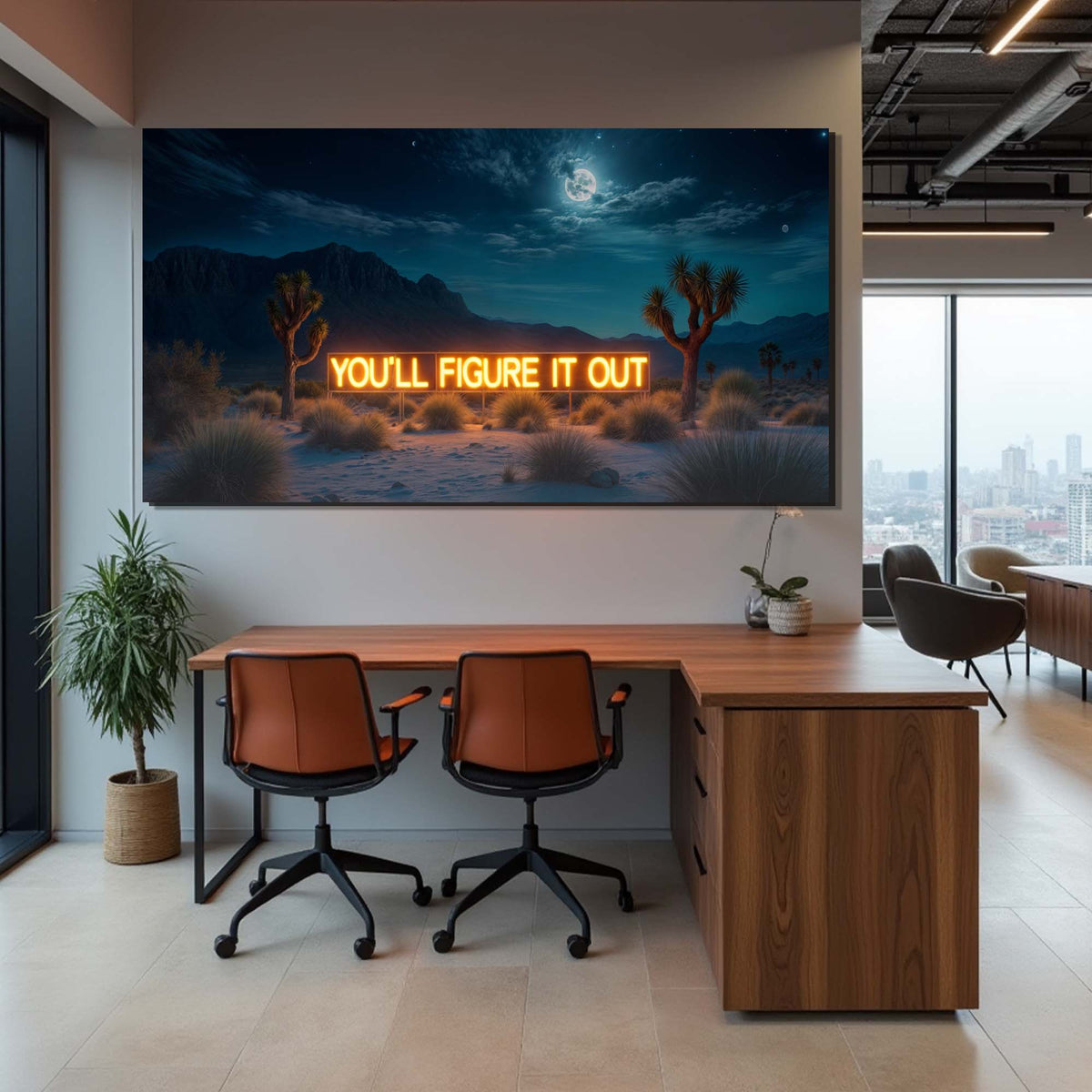 Modern office space with a large wall art piece displaying a desert scene with cacti and a neon sign.