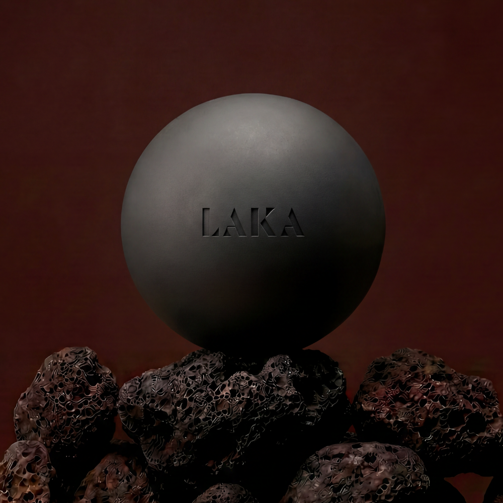 Dark gray sphere with 'LAKA' branding on a brown background