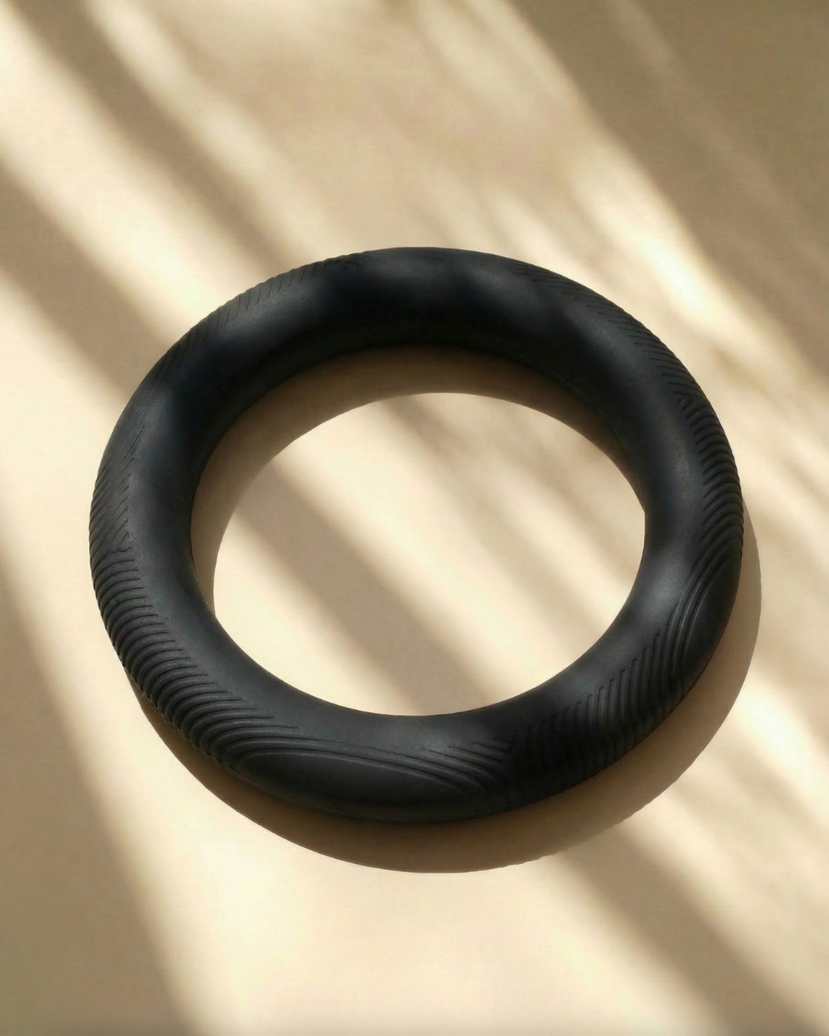 Black rubber ring on a beige background