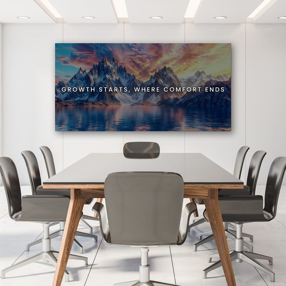 Modern conference room with a large wall mural of mountains and text.
