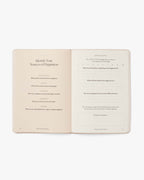 Open book with text on a white background