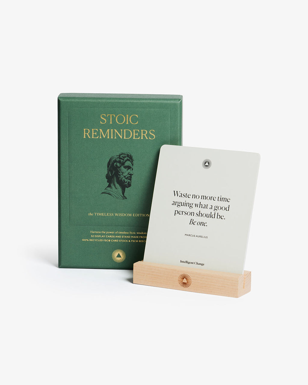 Green book titled 'Stoic Reminders' with a white card displaying a Stoic quote on a white background