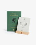 Green book titled 'Stoic Reminders' with a white card displaying a Stoic quote on a white background