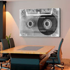 Cassette tape wall art with motivational quote in a modern office setting