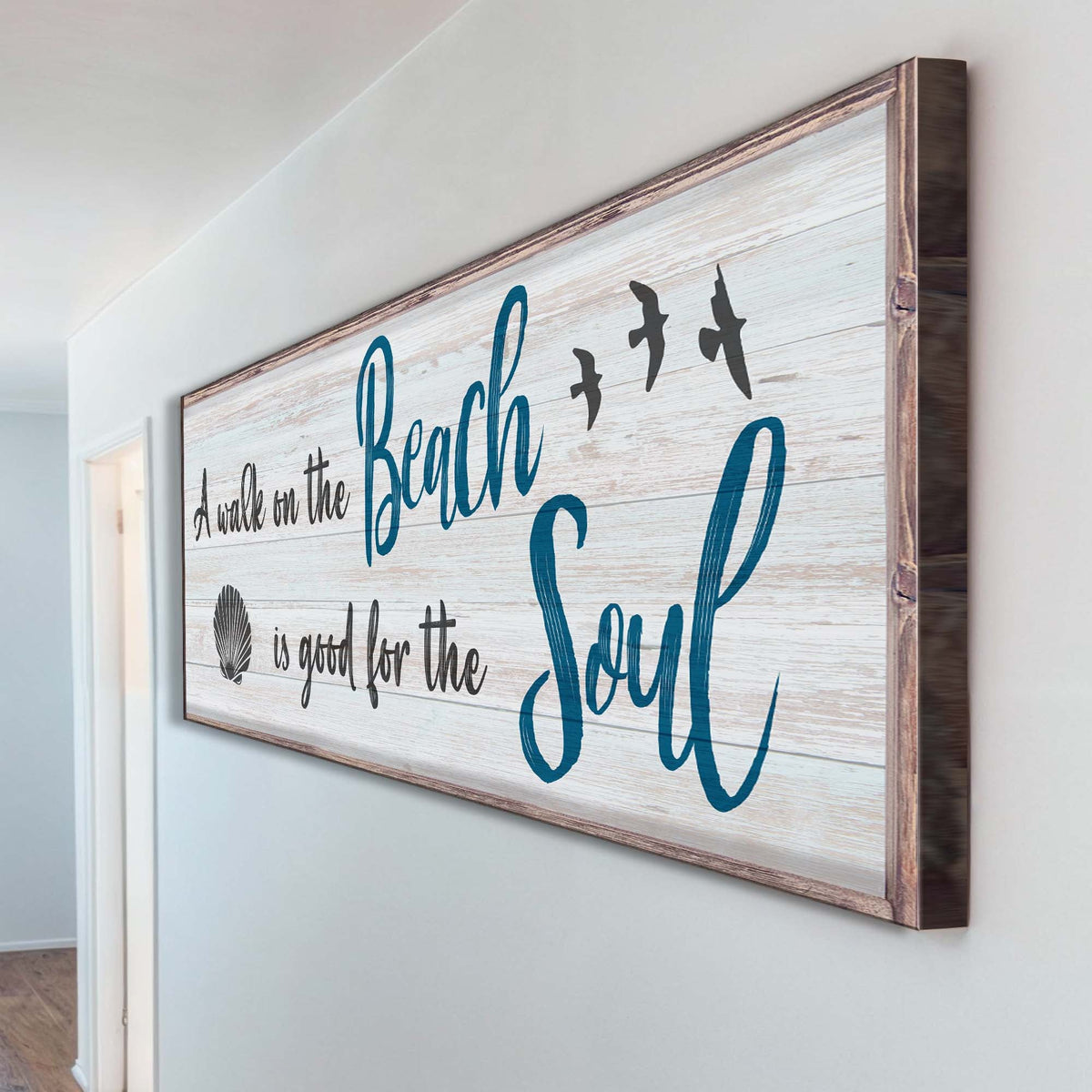 Wooden wall sign with 'Beach Soul' text on a white wall.