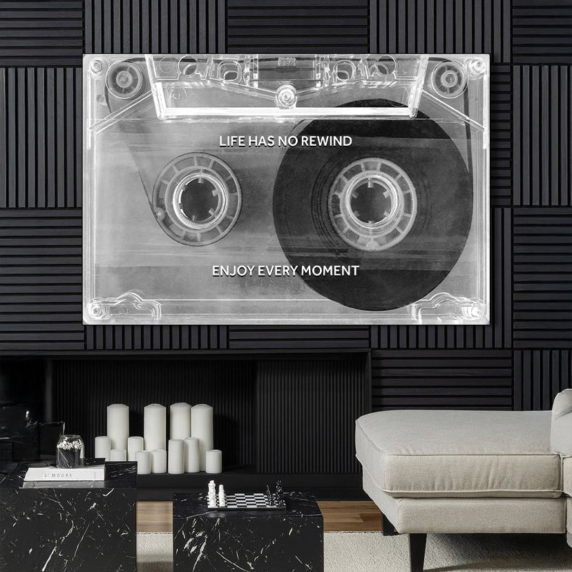 Cassette tape design wall art with motivational quote in a modern living room.