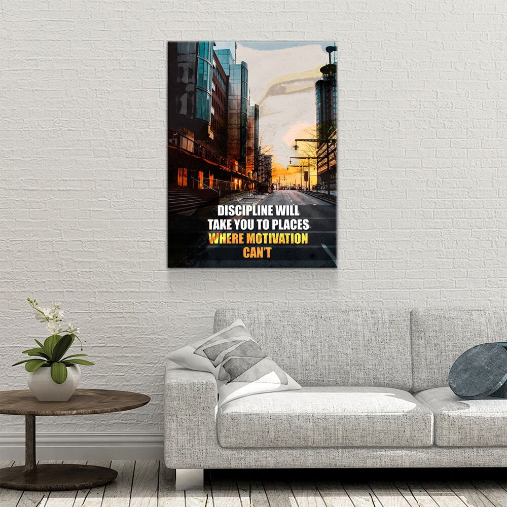 Sofa in a living room with a motivational quote poster on the wall.