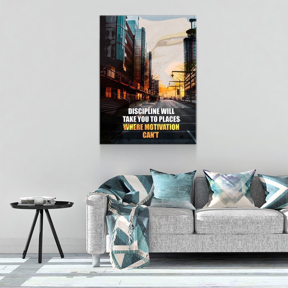 Living room with a motivational quote poster on the wall above a sofa.