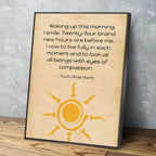 Framed quote by Thich Nhat Hanh with a sun design on a wooden surface and gray wall background