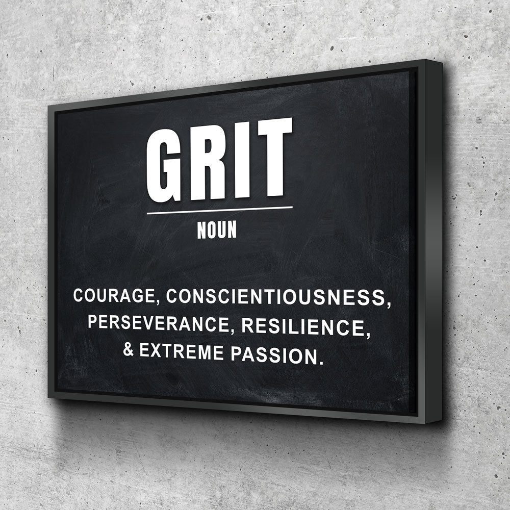A framed wall art print featuring a chalkboard-style background with the word 'GRIT' in large white letters and a dictionary-style definition below, mounted against a light gray textured wall.