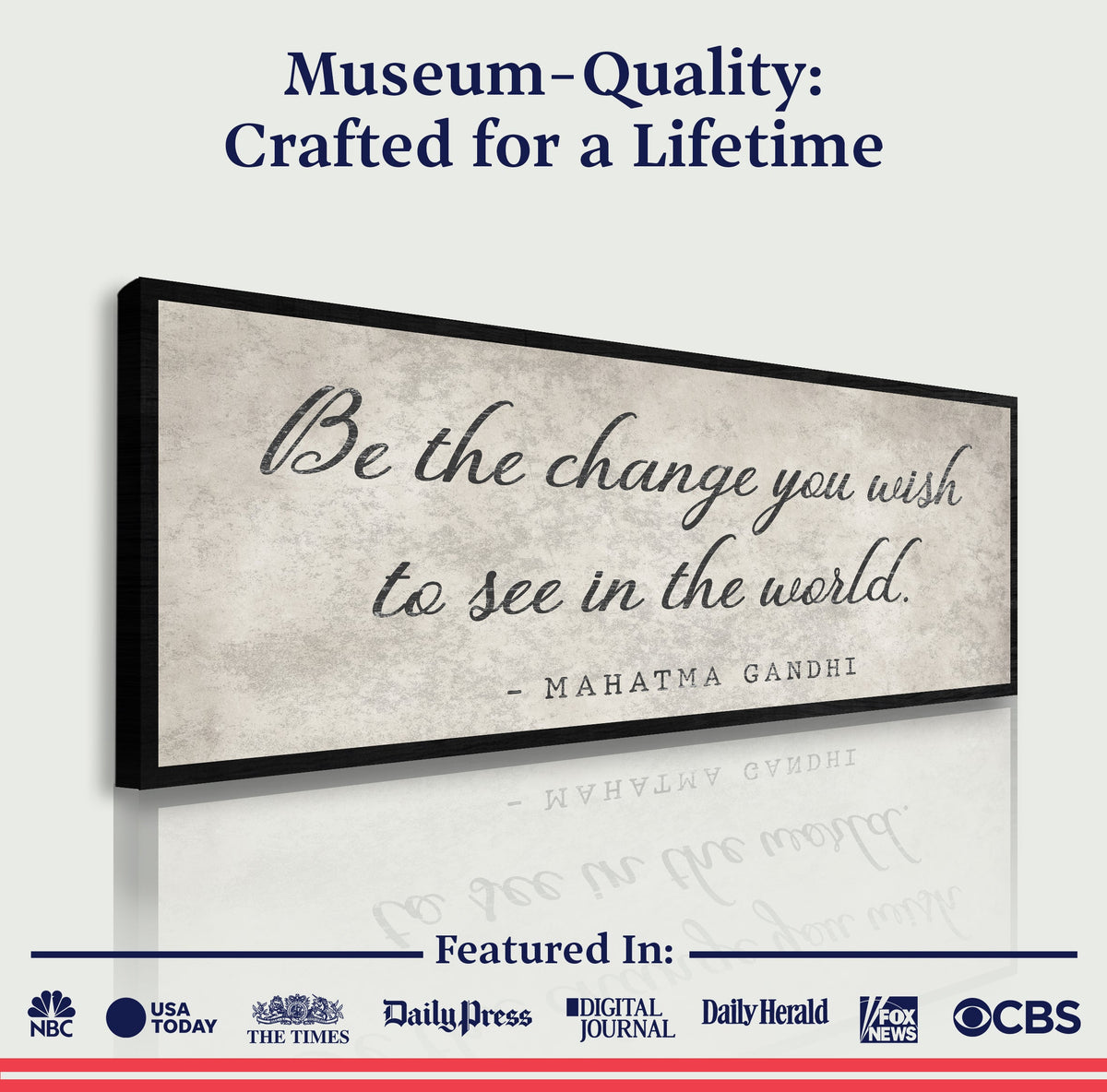Framed artwork with Gandhi quote 'Be the change you wish to see in the world' on a white background.