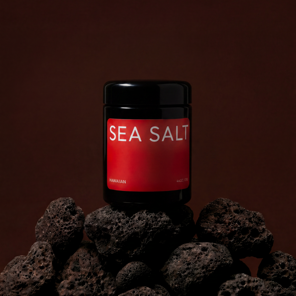 Jar of sea salt on a dark background with rocks