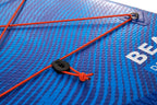 Close-up of a blue inflatable mat with orange strap and black buckle, featuring the brand 'Bear'.