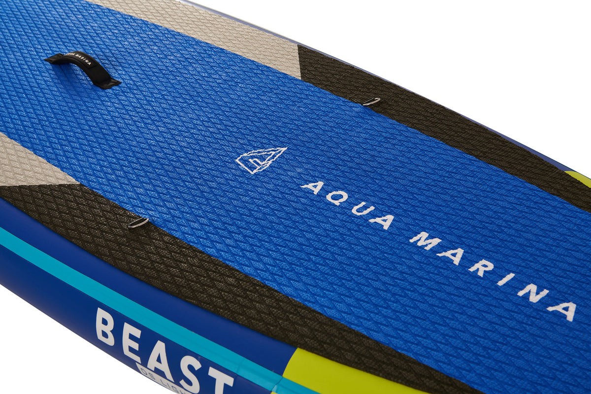 Close-up of a blue Aqua Marina paddleboard with 'Beast' branding on a white background