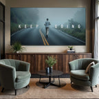 Living room with a motivational poster on the wall featuring a person running on a road with 'KEEP GOING' text.