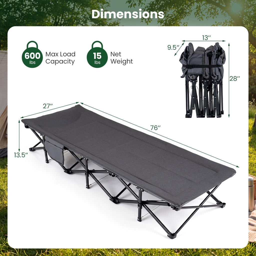 A folding camping cot shown with dimension callouts and weight/load capacity information. The cot is dark gray fabric with a black frame, displayed on a white panel over a blurred green outdoor background.