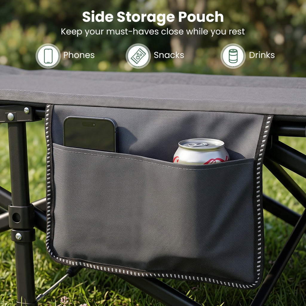 A dark gray side storage pouch attached to the side of a folding camp table outdoors on grass, shown holding a smartphone and a soda can. Text at the top reads 'Side Storage Pouch' with icons for Phones, Snacks, and Drinks.