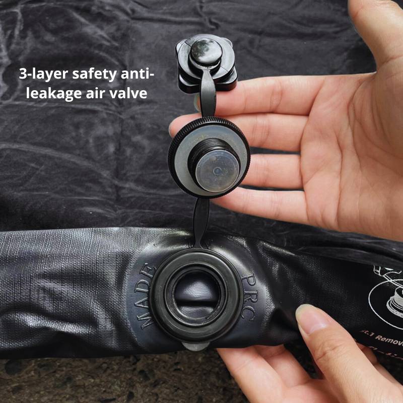 Hand holding a 3-layer safety anti-leakage air valve on a black background