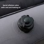 Spiral inflation valve on an inflatable boat with text indicating safety features.