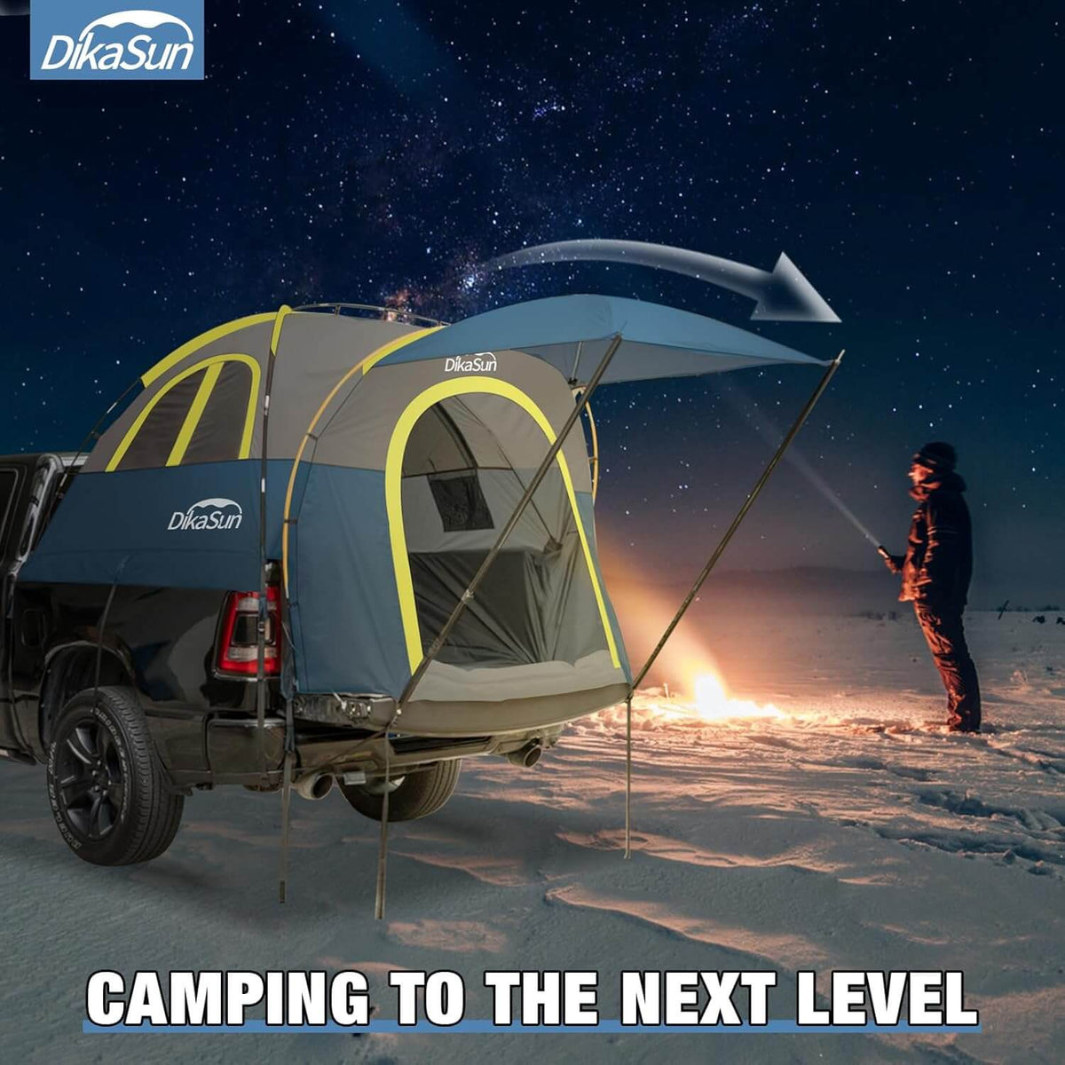 DikaSun truck tent set up in a snowy landscape with a person by a campfire, under a starry sky.