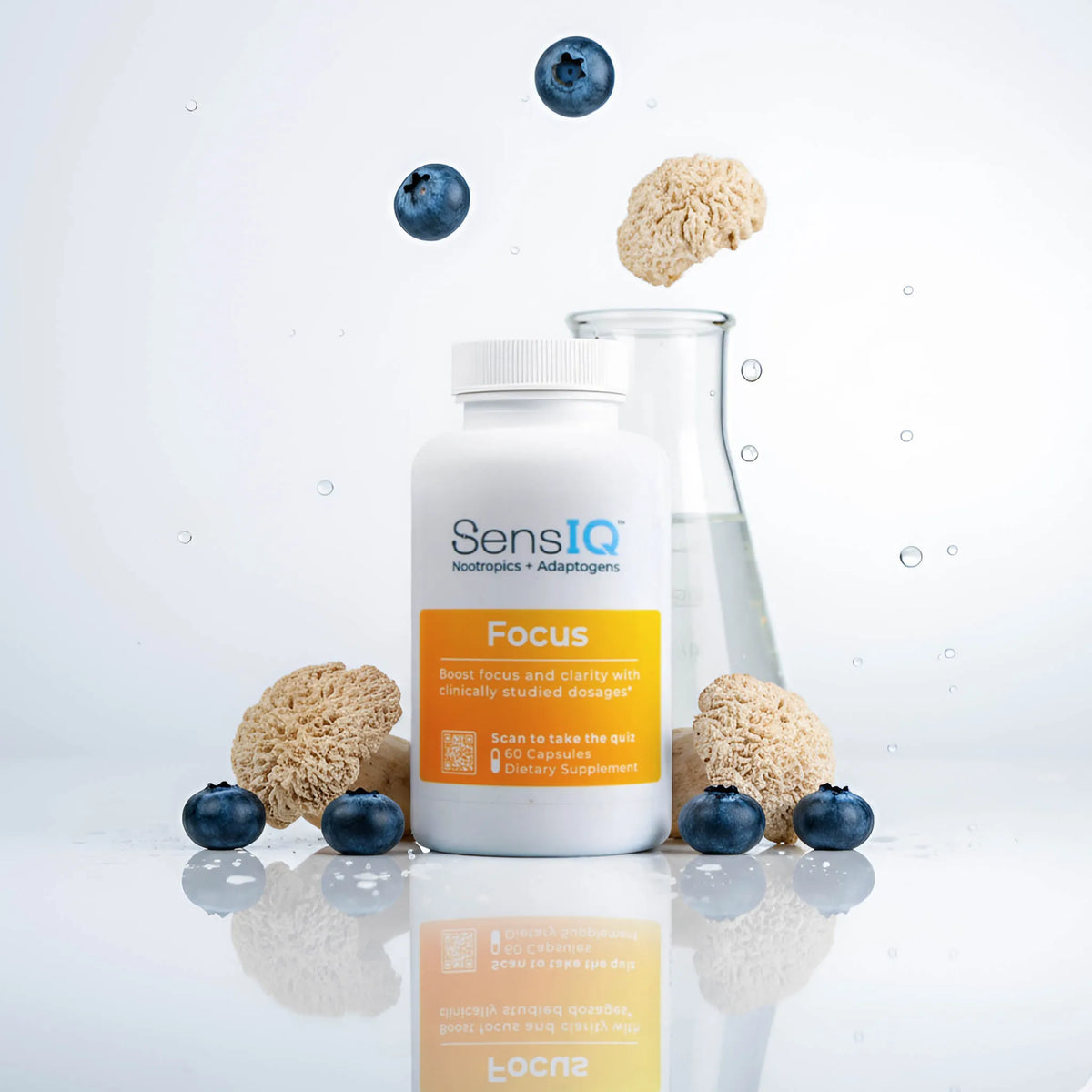 SensIQ Focus supplement bottle with blueberries and brain-shaped candies on a reflective surface.