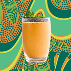 Orange smoothie in a glass with chia seeds on a colorful patterned background