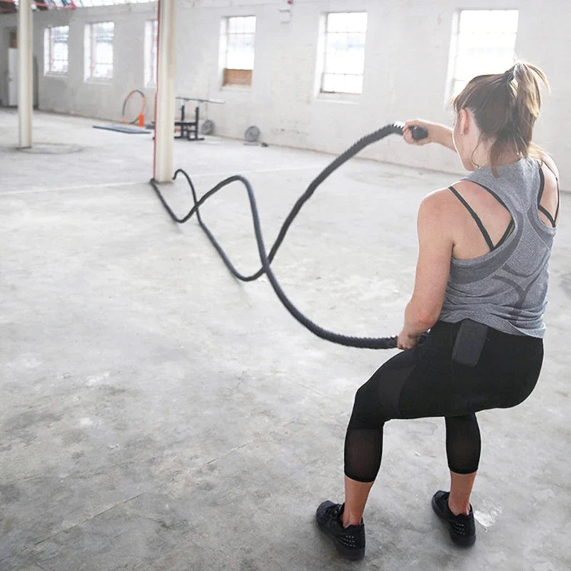 Woman using battle rope