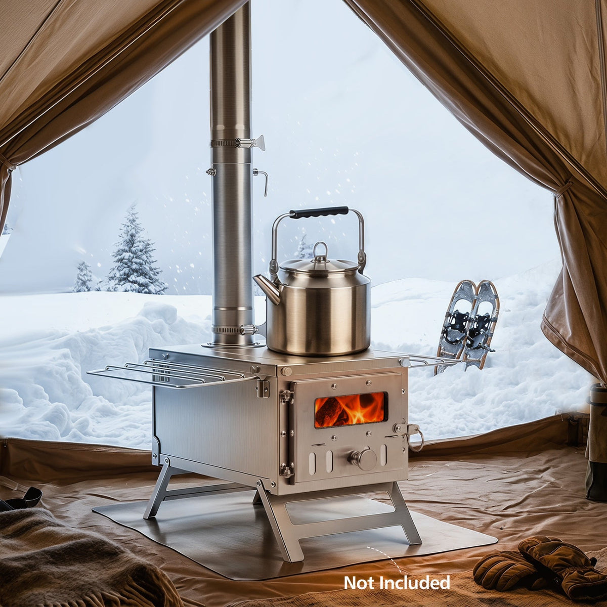 A stainless steel camp stove with a kettle on top, set inside a tent with a snowy outdoor view. A pair of snow boots and gloves are placed nearby, and a 'Not Included' text overlay is visible in the bottom right corner.