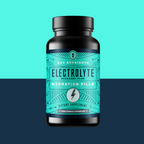 Bottle of Electrolyte Recovery Plus Hydration Pills on a two-tone blue background