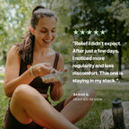 A woman sitting outdoors on grass in a park, eating from a clear plastic container. White text on the right reads a five-star review quote from Sarah G.