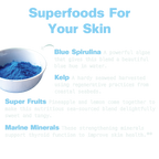 Superfoods for skin with blue spirulina powder in a bowl on a light gray background