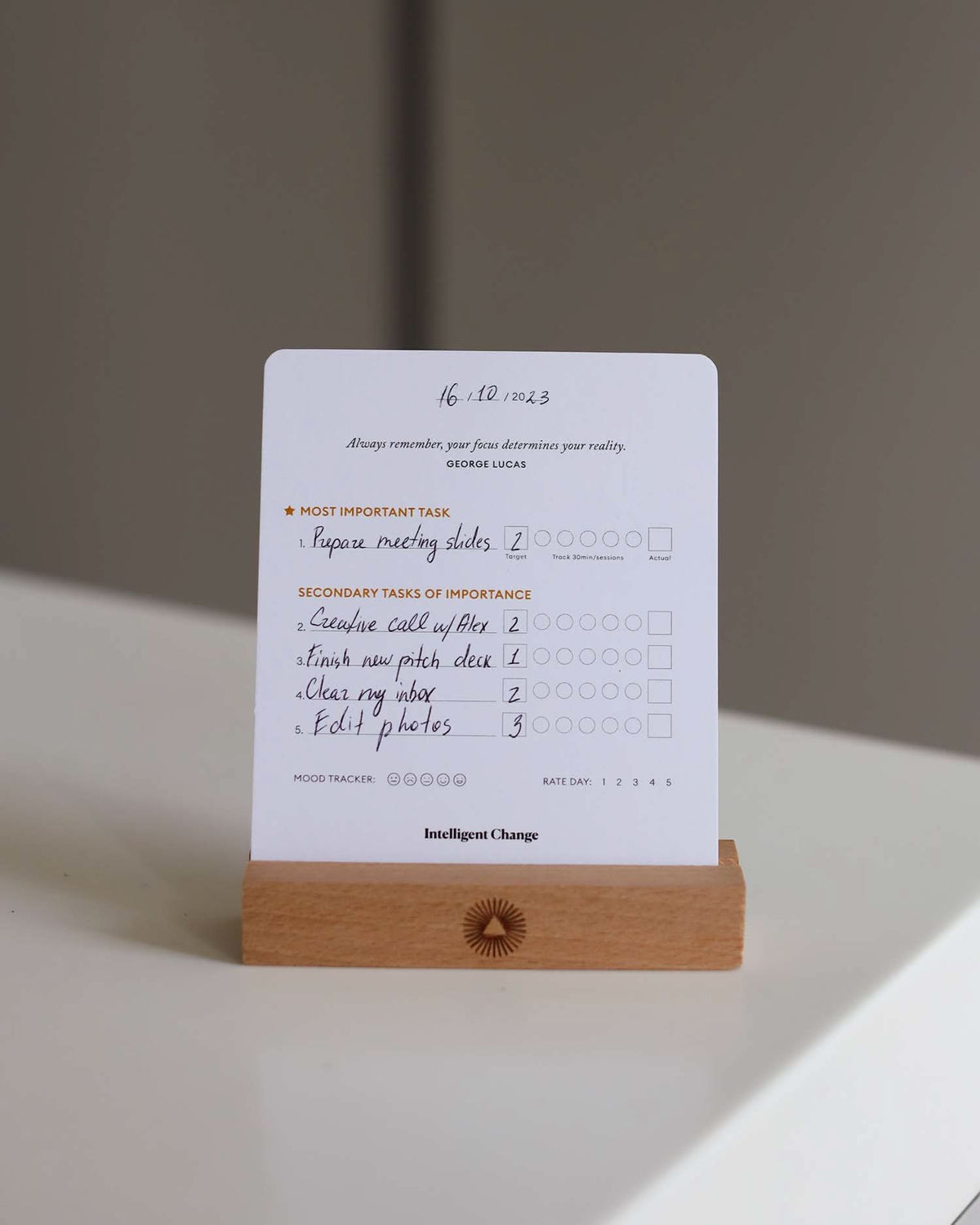 Notebook with a wooden stand on a light surface