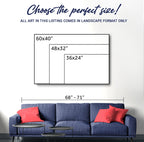 Wall art size chart with dimensions displayed above a blue sofa and red pillows.