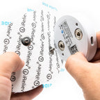 iReliev electronic device held by a hand with branding visible