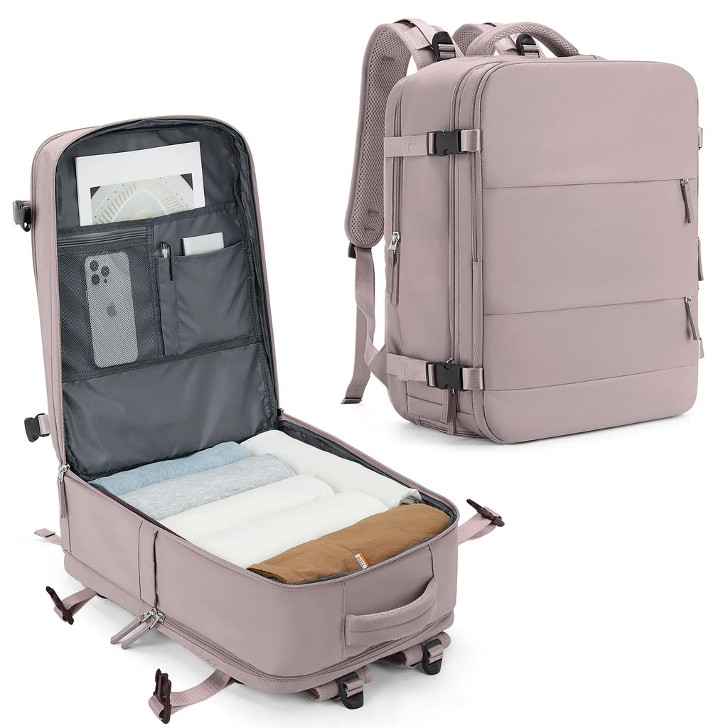 Pink travel backpack with open compartment showing organized items on a white background