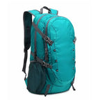 Teal backpack with gray straps on a white background
