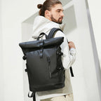 Man wearing a black backpack against a white background