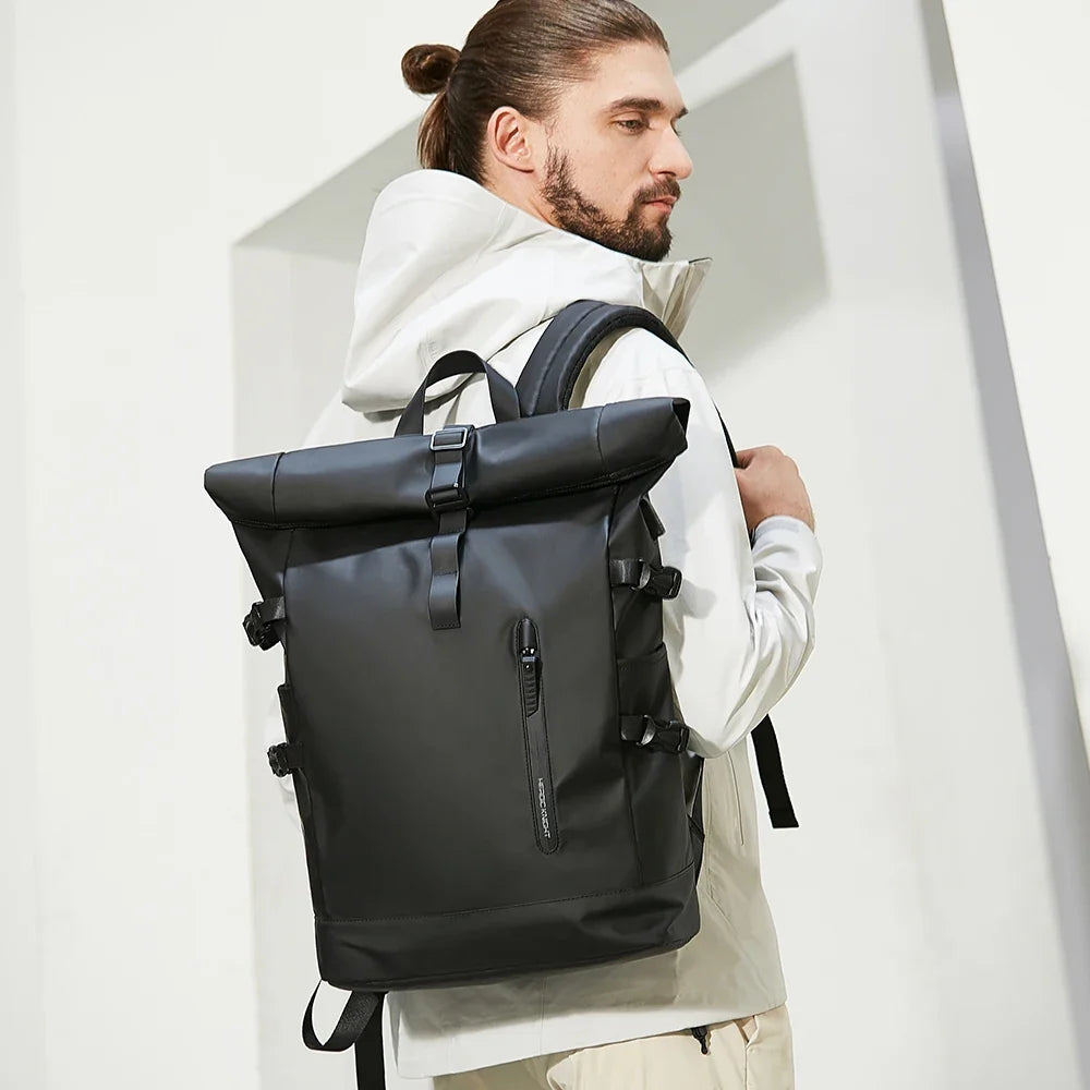 Man wearing a black backpack against a white background