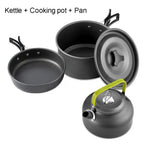 Set of camping cookware including pots, pans,