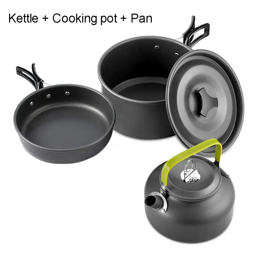 Set of camping cookware including pots, pans,