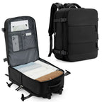 Black travel backpack with open compartment showing organized items on a white background